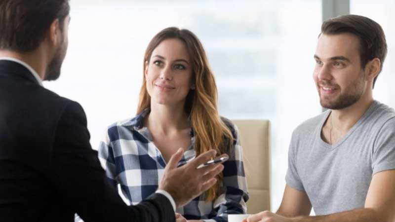 Couple talking with an attorney